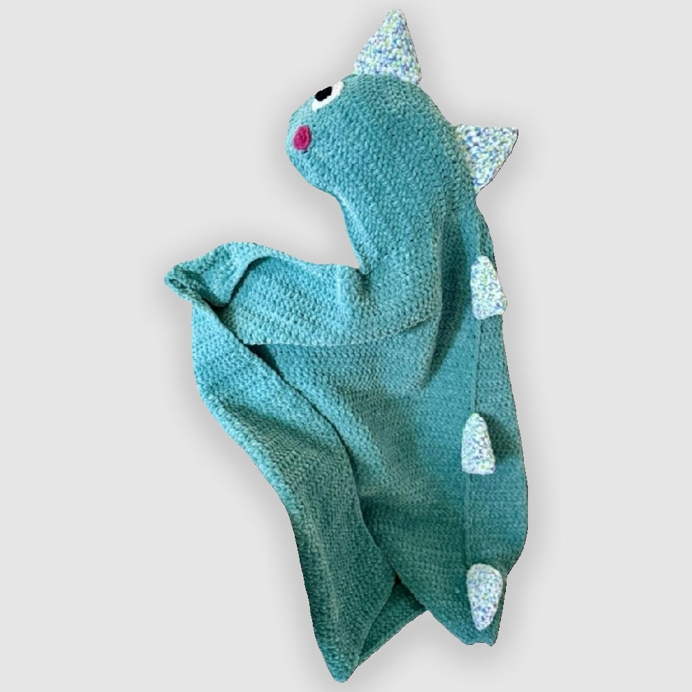 Cozy dinosaur blanket with hood – handmade crochet blanket for children.